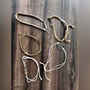 Lot of woven boho style tan and cream bracelets with metal details